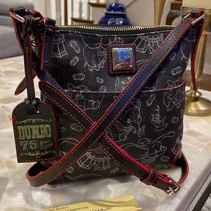 Like new Disney Dooney & Bourke 75 Year Dumbo crossbody purse.